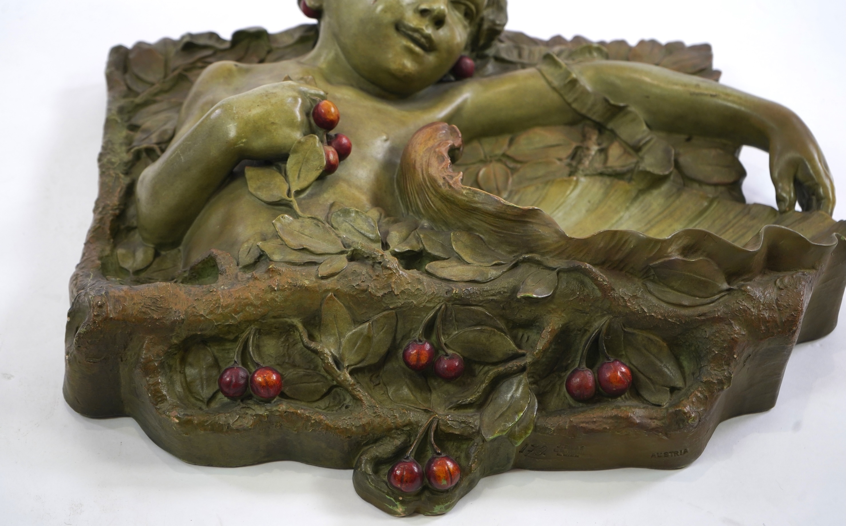 A large Austrian cold painted terracotta wall plaque, by J. Pilar, c.1900